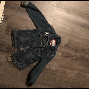 Change jacket with appliqué cross